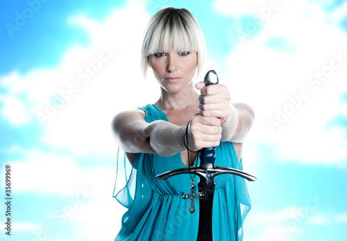 woman with sword and cross photo