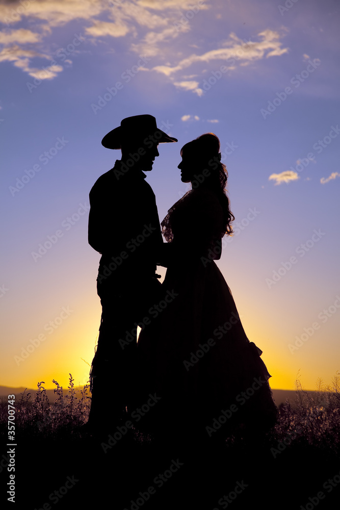 Naklejka premium Cowboy couple silhouette love