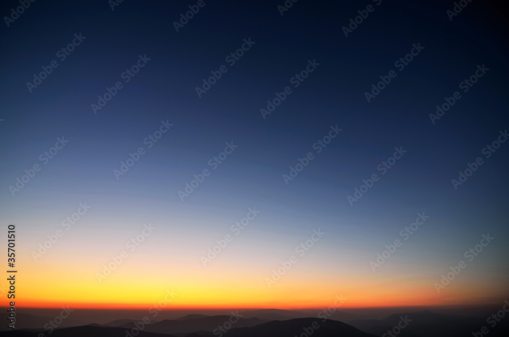 Colors of evening sky above the mountains