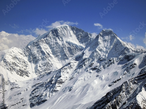 Mountain under the blue sky and the clouds © scullery