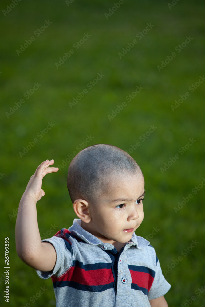 The boy walks in the park and about something dreams The boy walks in the park and about something dreams