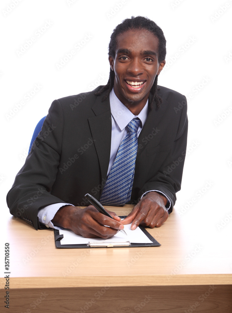 African American businessman signing document African American businessman signing document