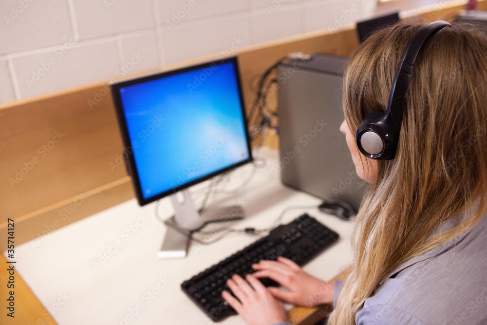 Blonde operator using a computer Blonde operator using a computer