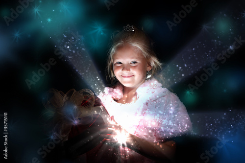 Child opening a magic gift box