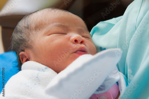 Face of Asian female newborn fall asleep