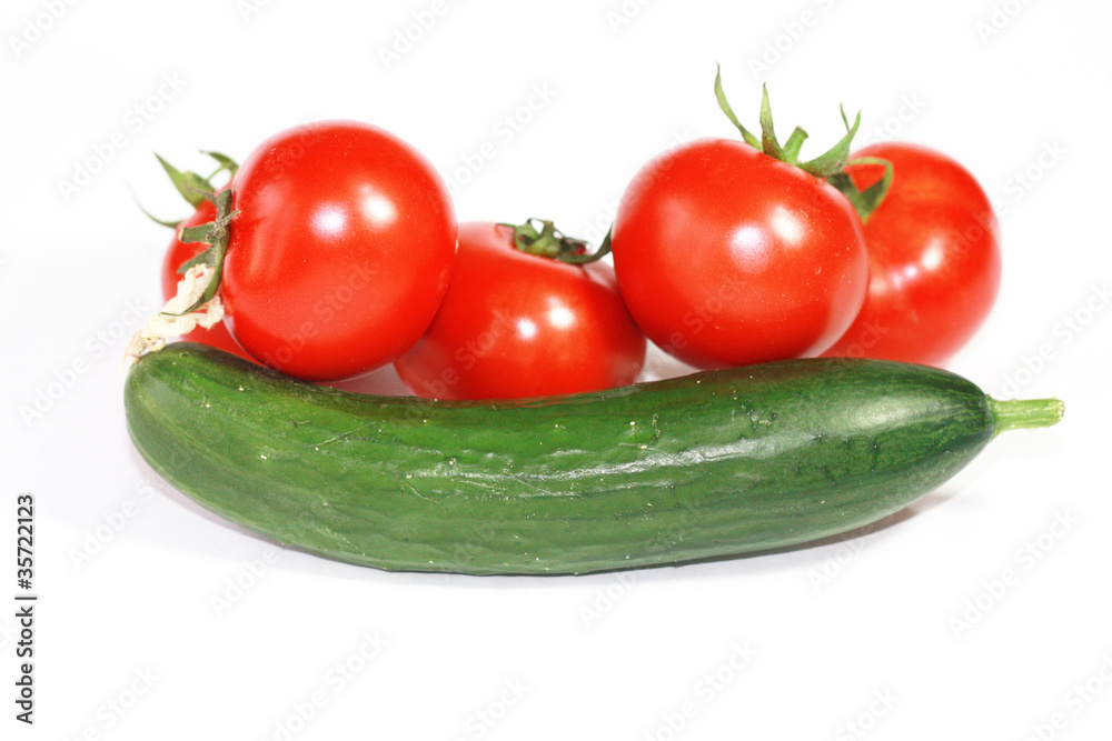 Fresh cucumber and tomatoes on white background Fresh cucumber and tomatoes on white background