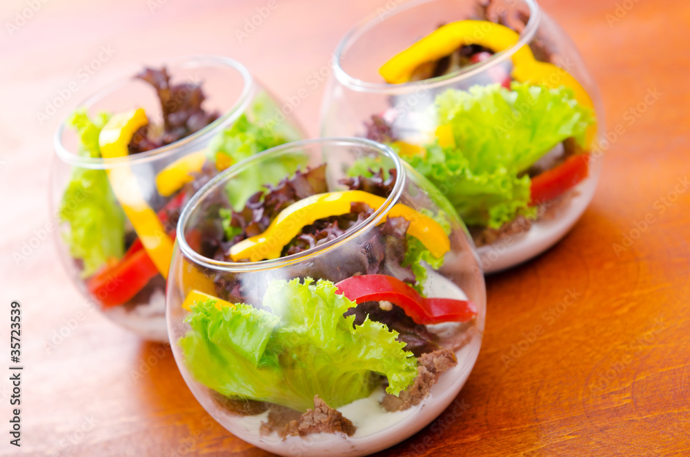 Fresh healthy salad in bowls Fresh healthy salad in bowls