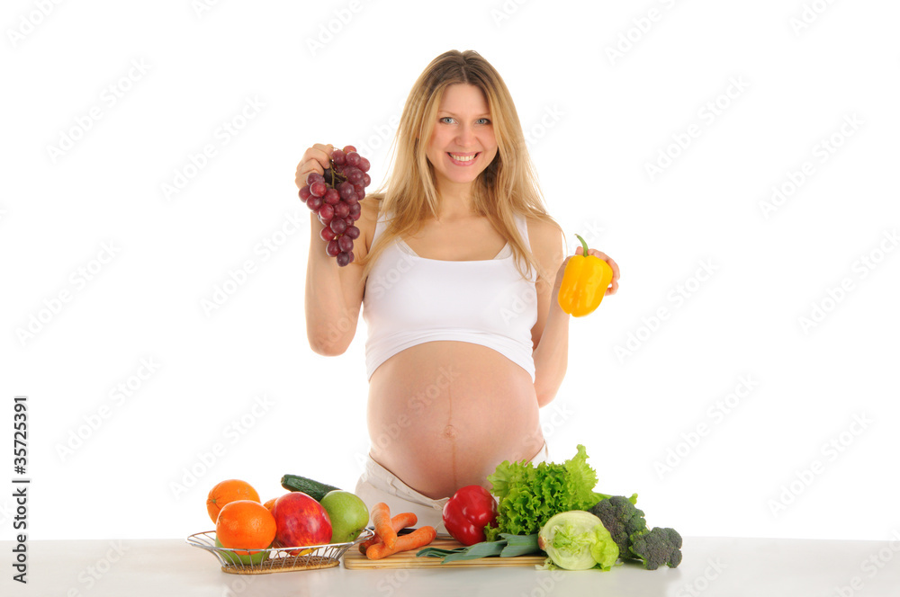 Happy pregnant woman with fruits and vegetables Happy pregnant woman with fruits and vegetables