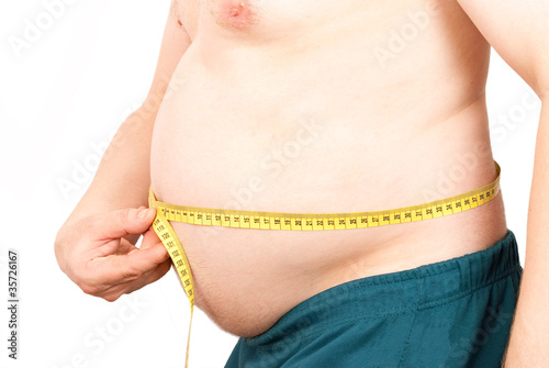 Fat man holding a measurement photo