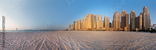 Woman looks at the Dubai City (Marina) at the Jumeirah Beach