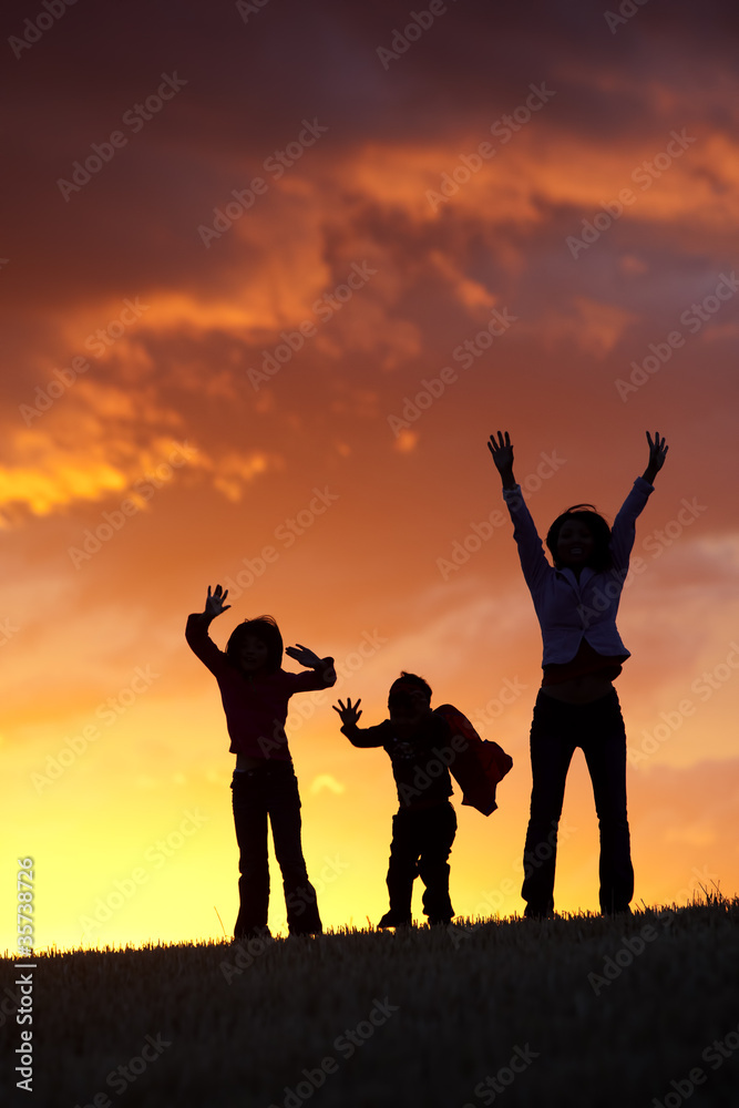 Jumping up at sunset.