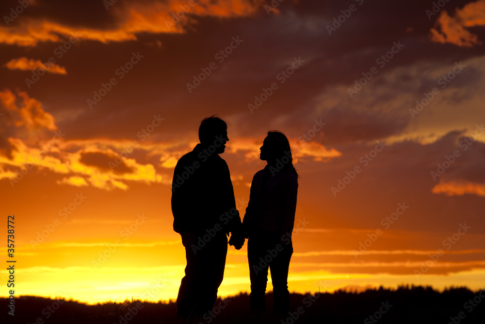 Romantic couple at sunset.