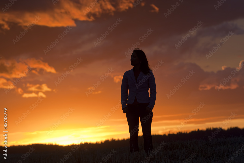 Woman at sunset.