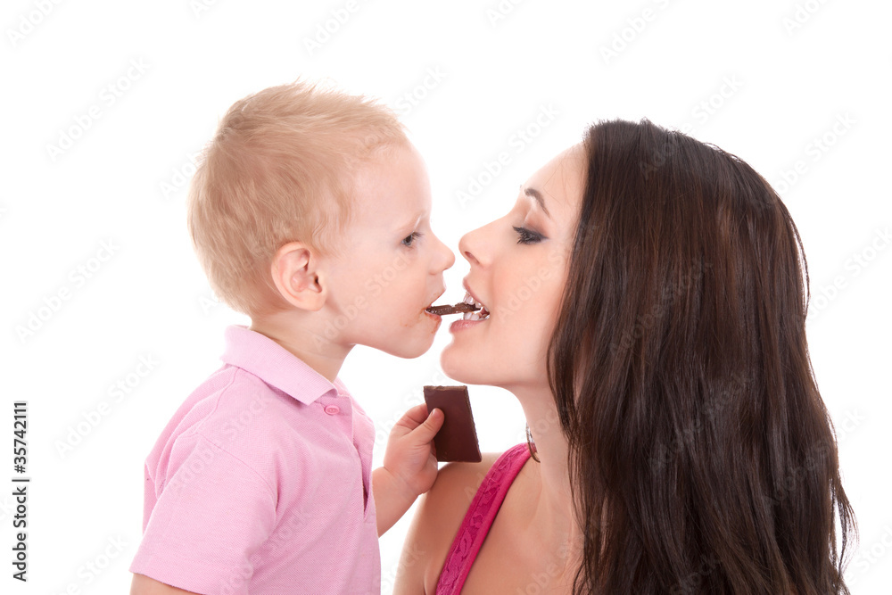 happy family of son feed his mother chocolate bar happy family of son feed his mother chocolate bar