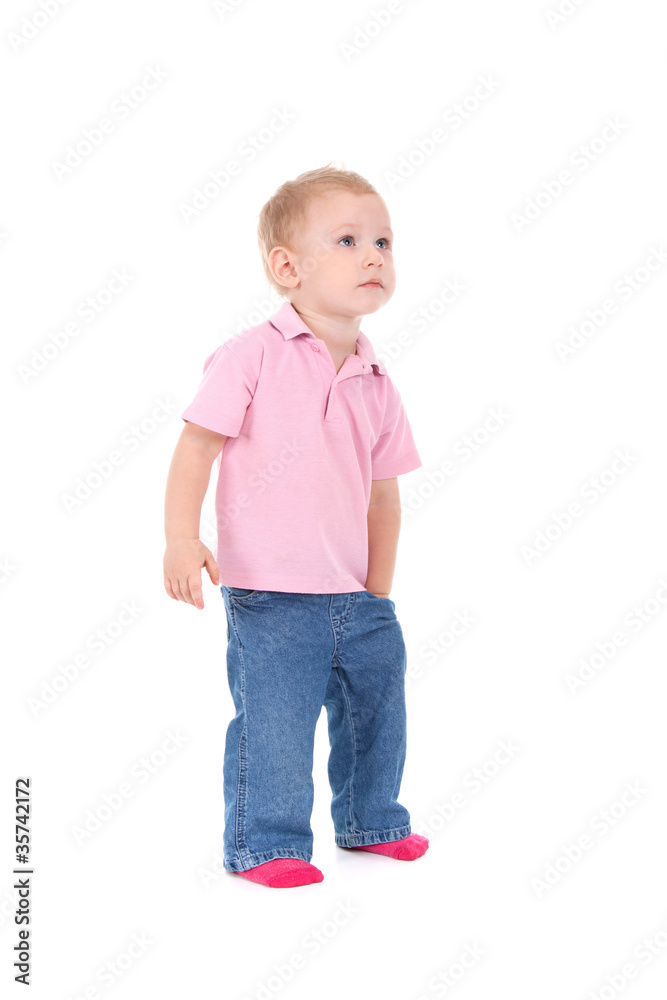Little boy hold hand in pocket look up isolated over white Little boy hold hand in pocket look up isolated over white