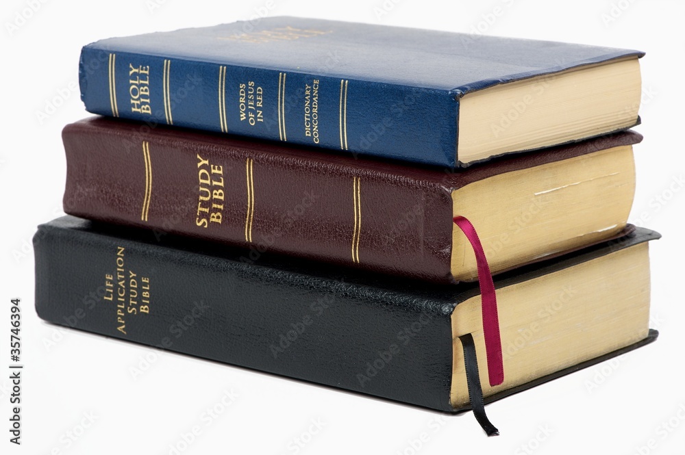 Stack of old bibles stock photo adobe stock