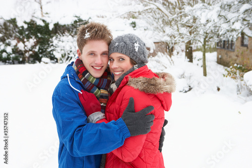 Young couple in snow © micromonkey