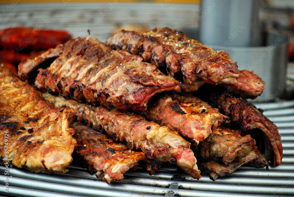 edges prepared on spanish barbecue at fair in barcelona, spain,