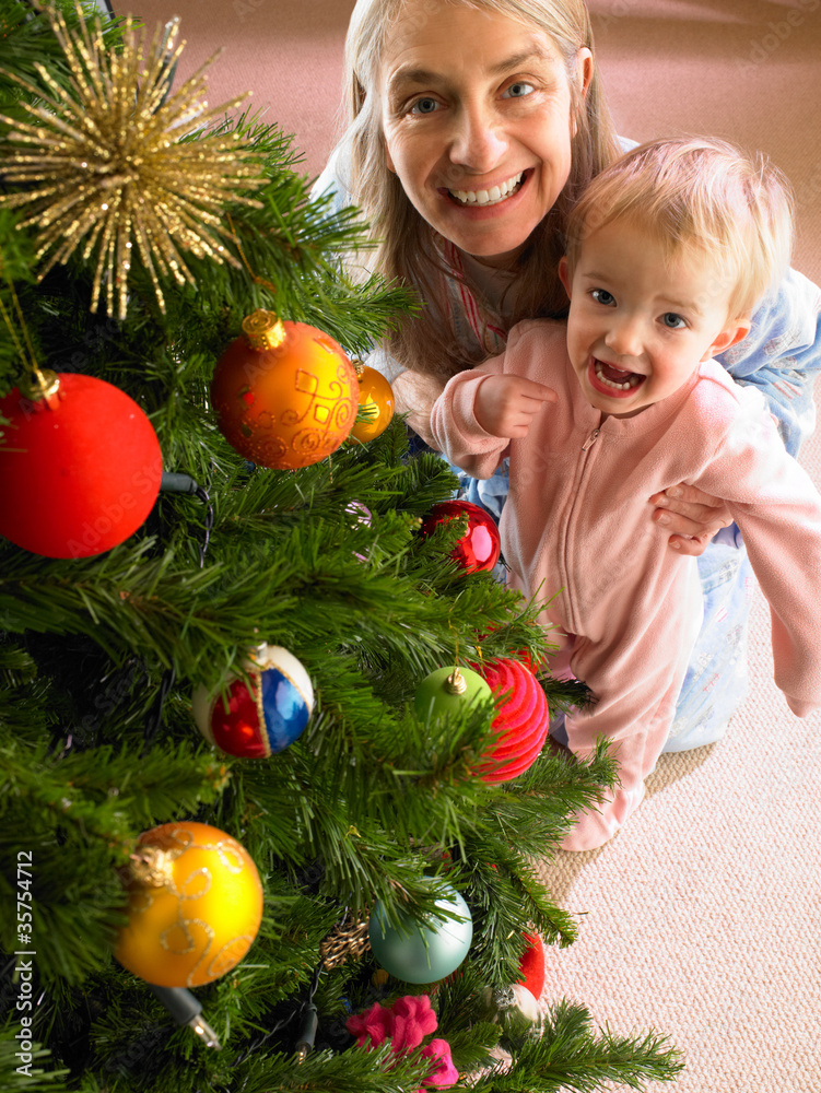Mother and daughter with Christmas tree Mother and daughter with Christmas tree