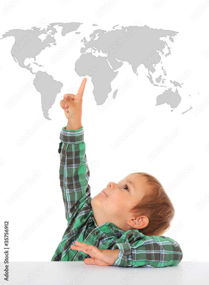 Kleiner Junge zeigt auf Weltkarte Kleiner Junge zeigt auf Weltkarte