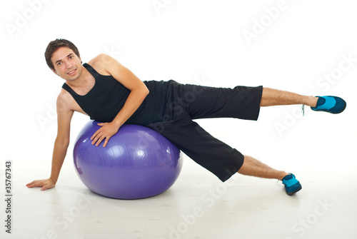 Man doing fitness exercise on ball