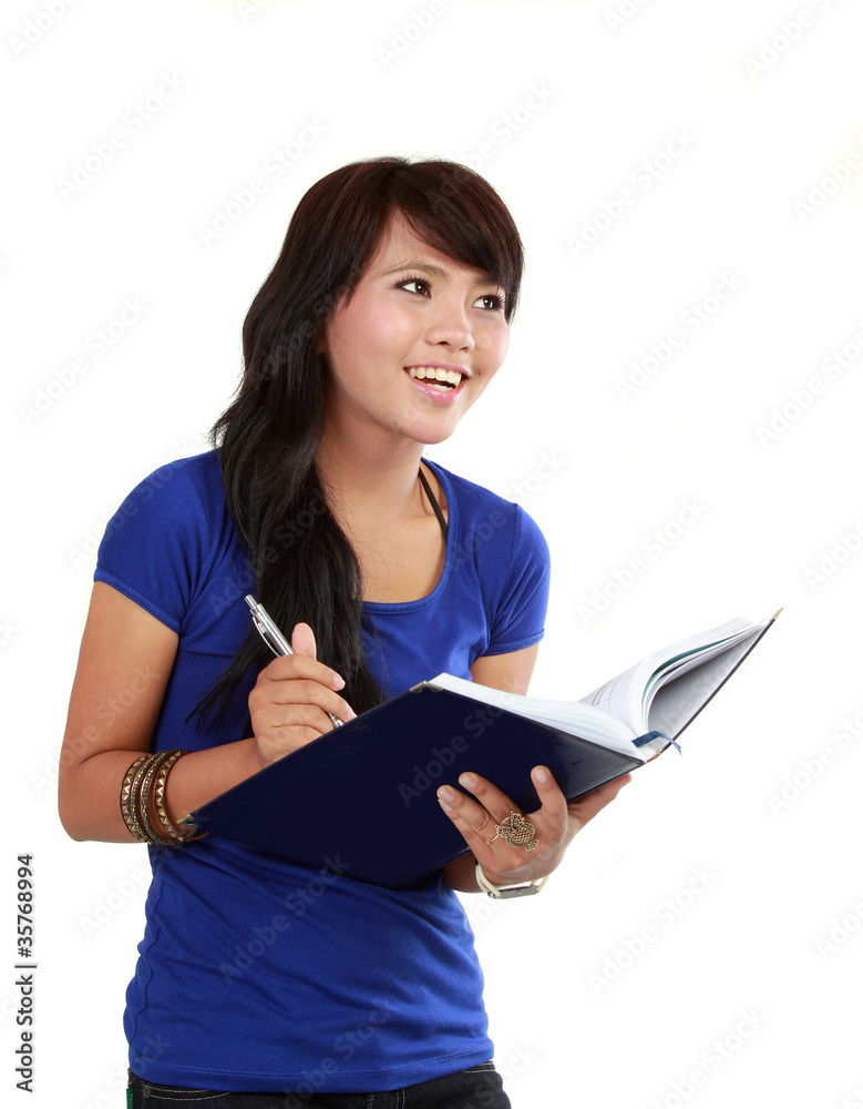 a woman writing a book