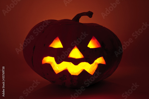Glowing pumpkin with a candle inside