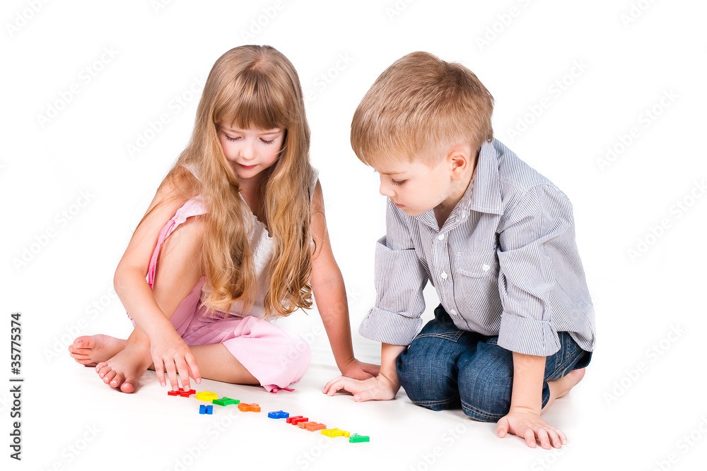 two playing kids with alphabet isolated on white background two playing kids with alphabet isolated on white background