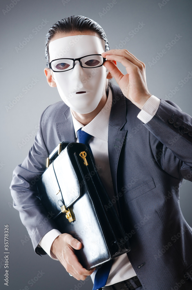 Industrial espionate concept with masked businessman Industrial espionate concept with masked businessman