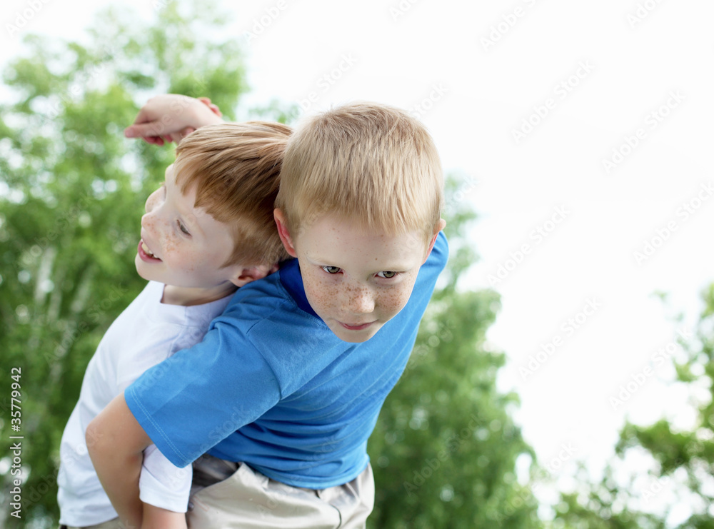 Fototapeta premium Portrait of two boys in the summer outdoors