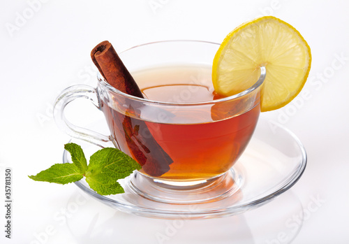 Cup of tea with lemon, cinnamon and mint