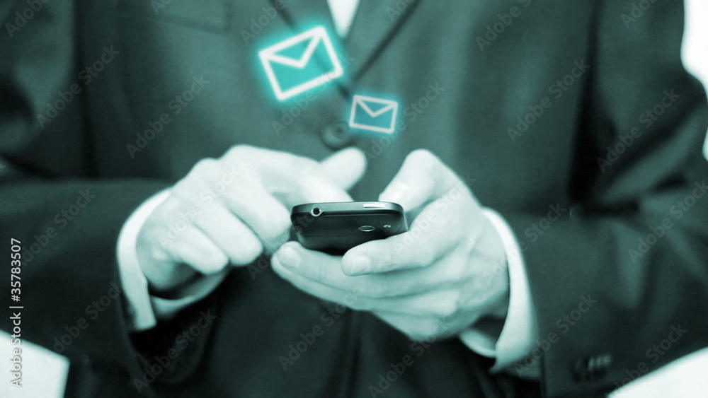 Businessman using mobile phone for text messaging