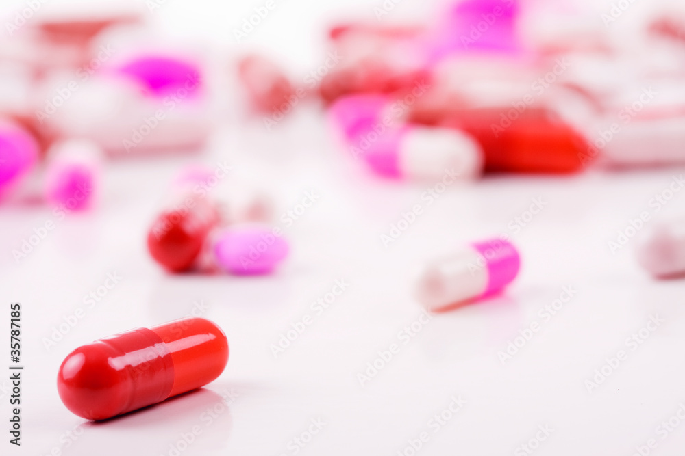 Assorted pills against white background Assorted pills against white background