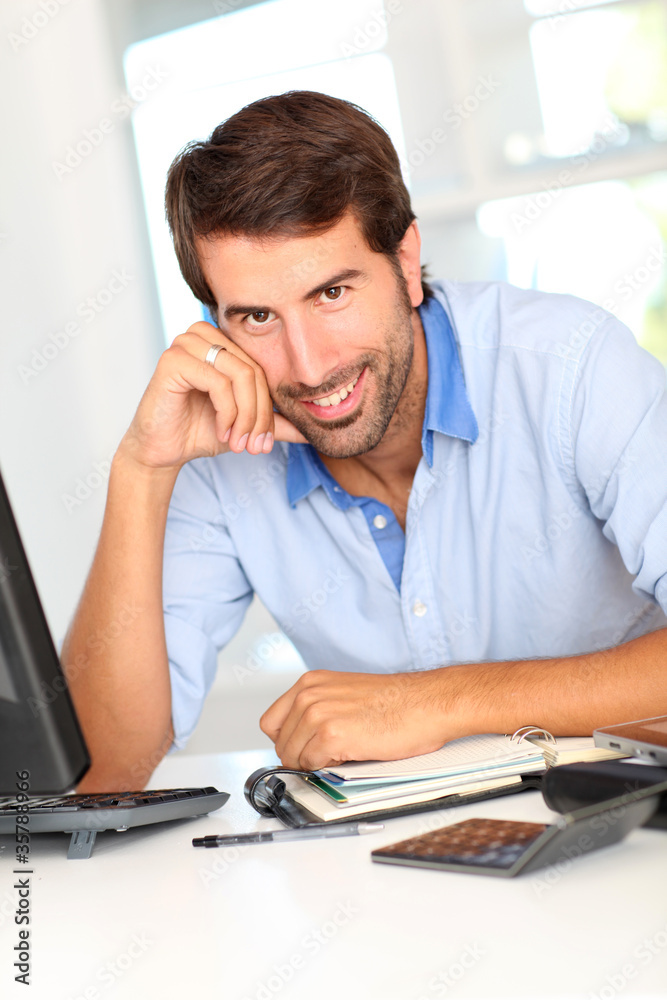 Fototapeta premium Portrait of happy office worker