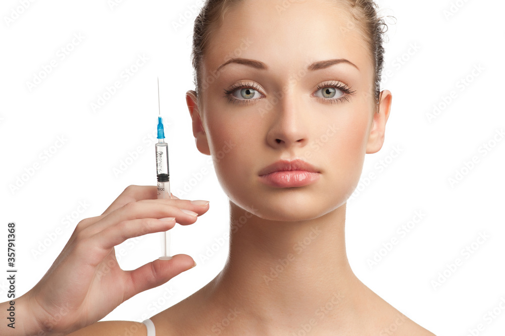 Beautiful woman with syringe in her hand