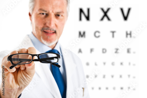 Oculist giving you a pair of eyeglasses