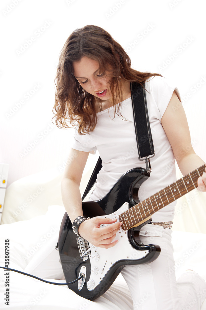 Fototapeta premium Portrait of young pretty girl who is feeling free and playing gu