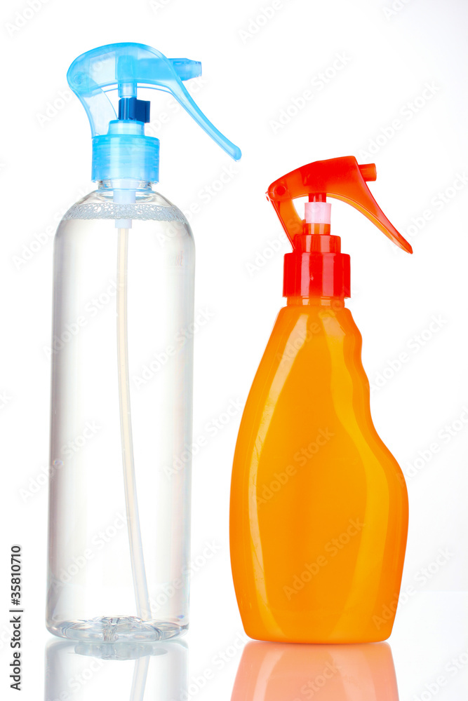 transparent and orange detergent bottles isolated on white transparent and orange detergent bottles isolated on white