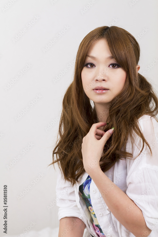 Beautiful asian woman relaxing in bed room Beautiful asian woman relaxing in bed room
