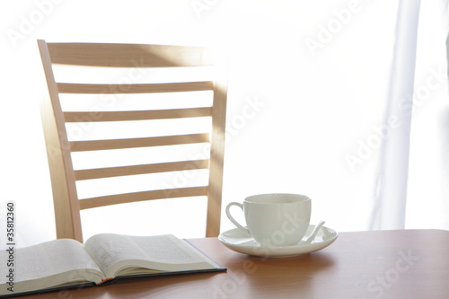 coffee Cup book and plant on wooden table © ryanking999
