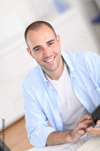 Smiling man sitting in office