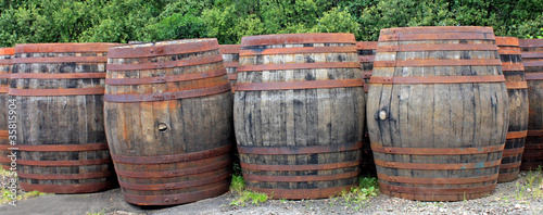 A Collection of Old Wooden Whisky Oak Barrels.