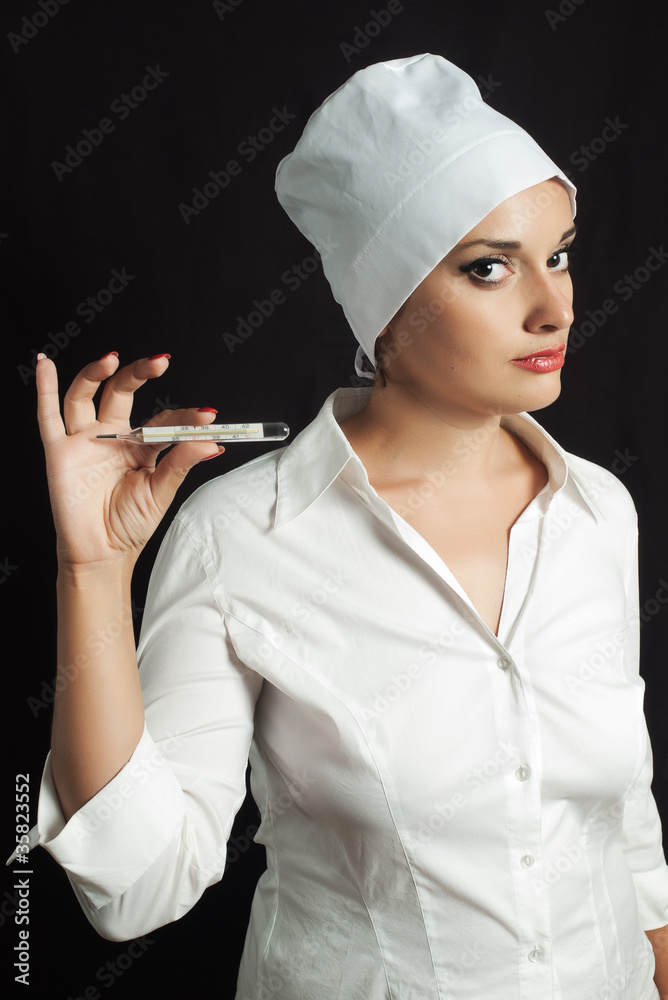 female nurse in white cap with glass thermometer female nurse in white cap with glass thermometer