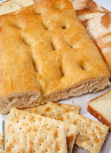 Closeup of genoese focaccia, bread and crackers.