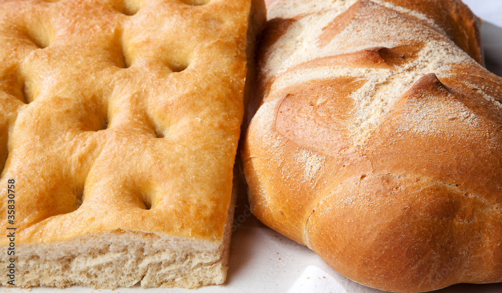 Closeup of genoese focaccia and bread.