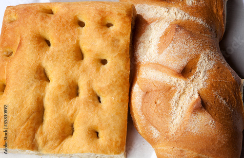 Closeup of genoese focaccia and bread.