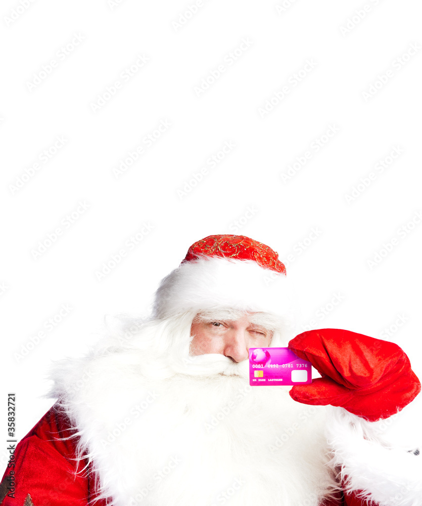 Traditional Santa Claus holding and sowing credit card while giv Traditional Santa Claus holding and sowing credit card while giv