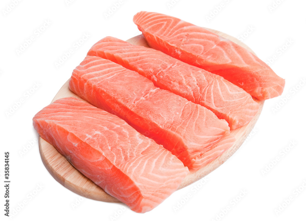 Five slice of fresh salmon on cutting board Five slice of fresh salmon on cutting board