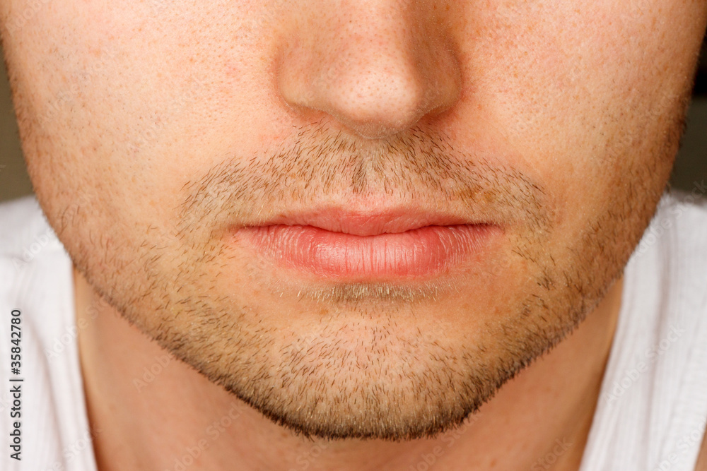 Close up of man's face sporting a 5 o'clock shadow Close up of man's face sporting a 5 o'clock shadow
