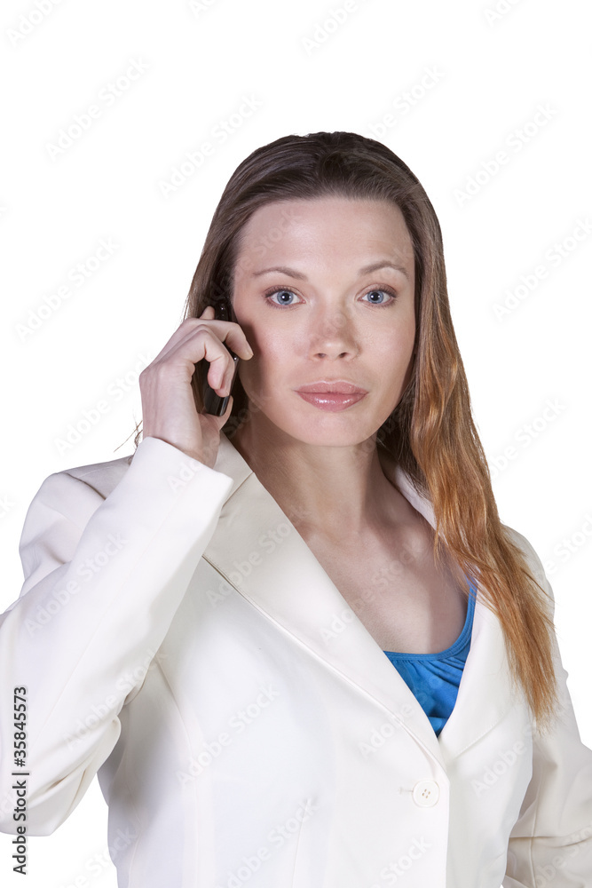 Businesswoman at Talking on the Cell Phone at Work Businesswoman at Talking on the Cell Phone at Work